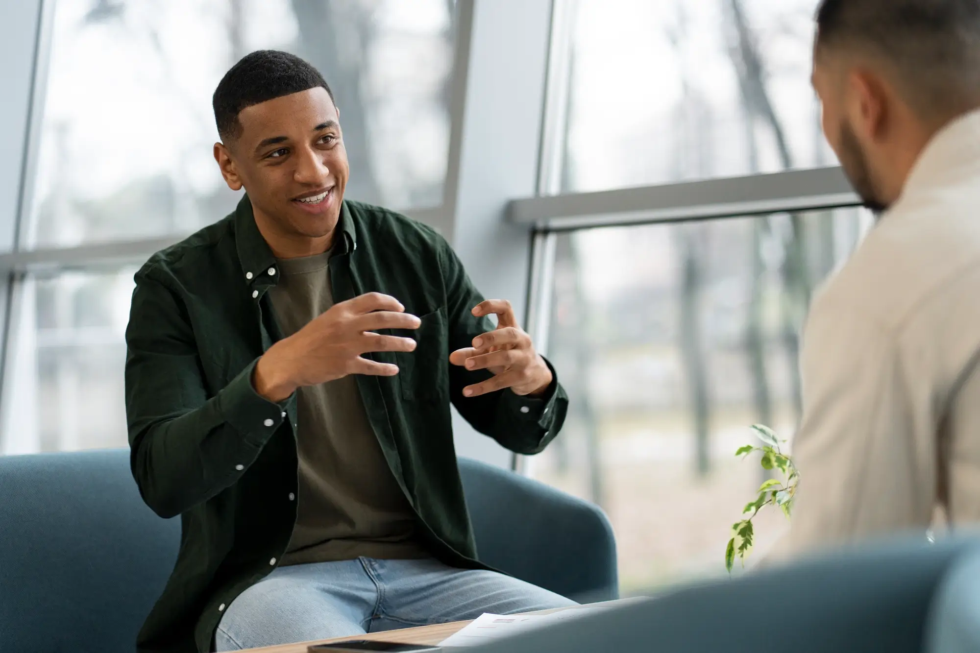 man talking to healthcare provider in a medical clinic