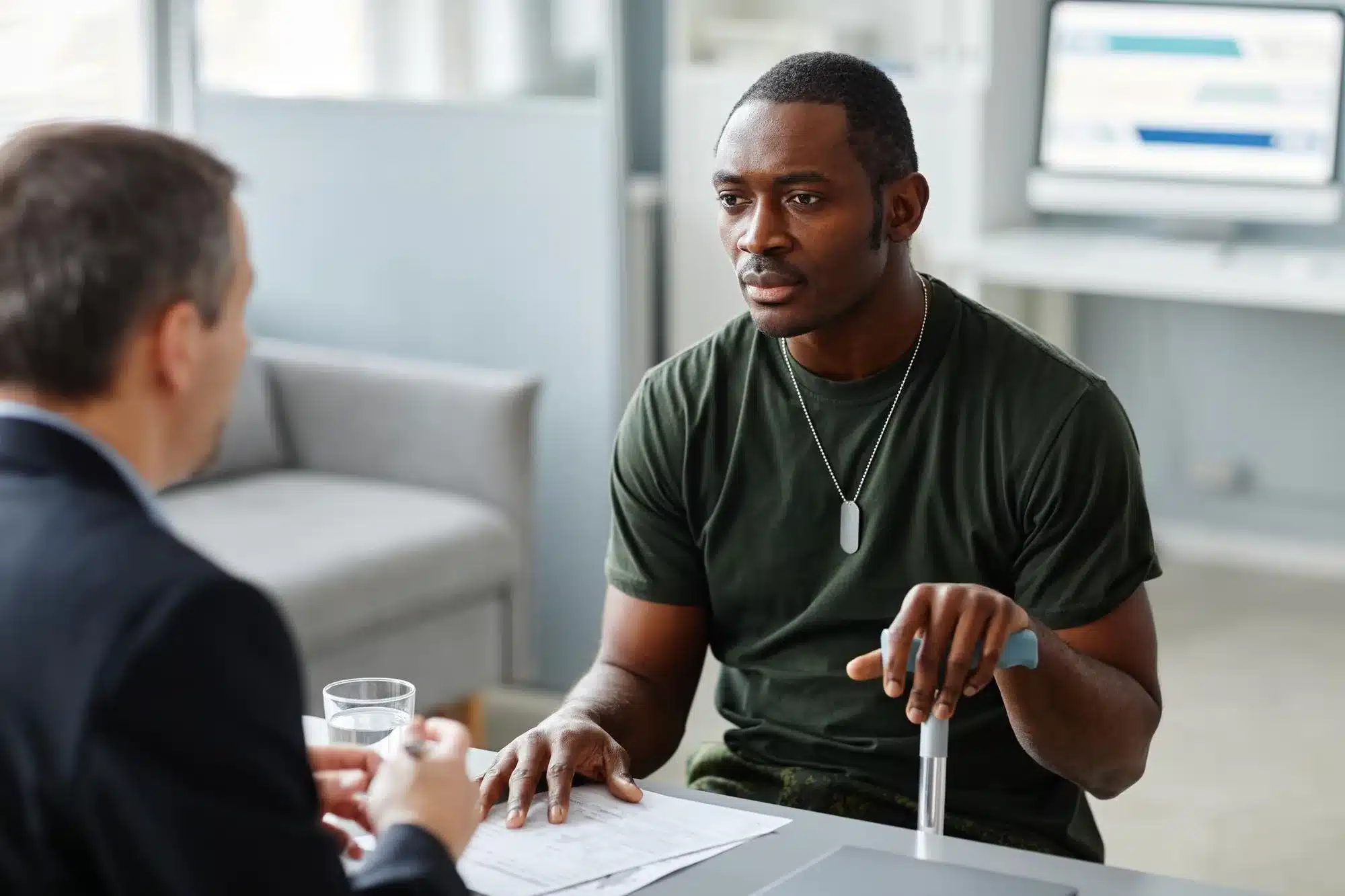man talking to healthcare provider in a medical clinic