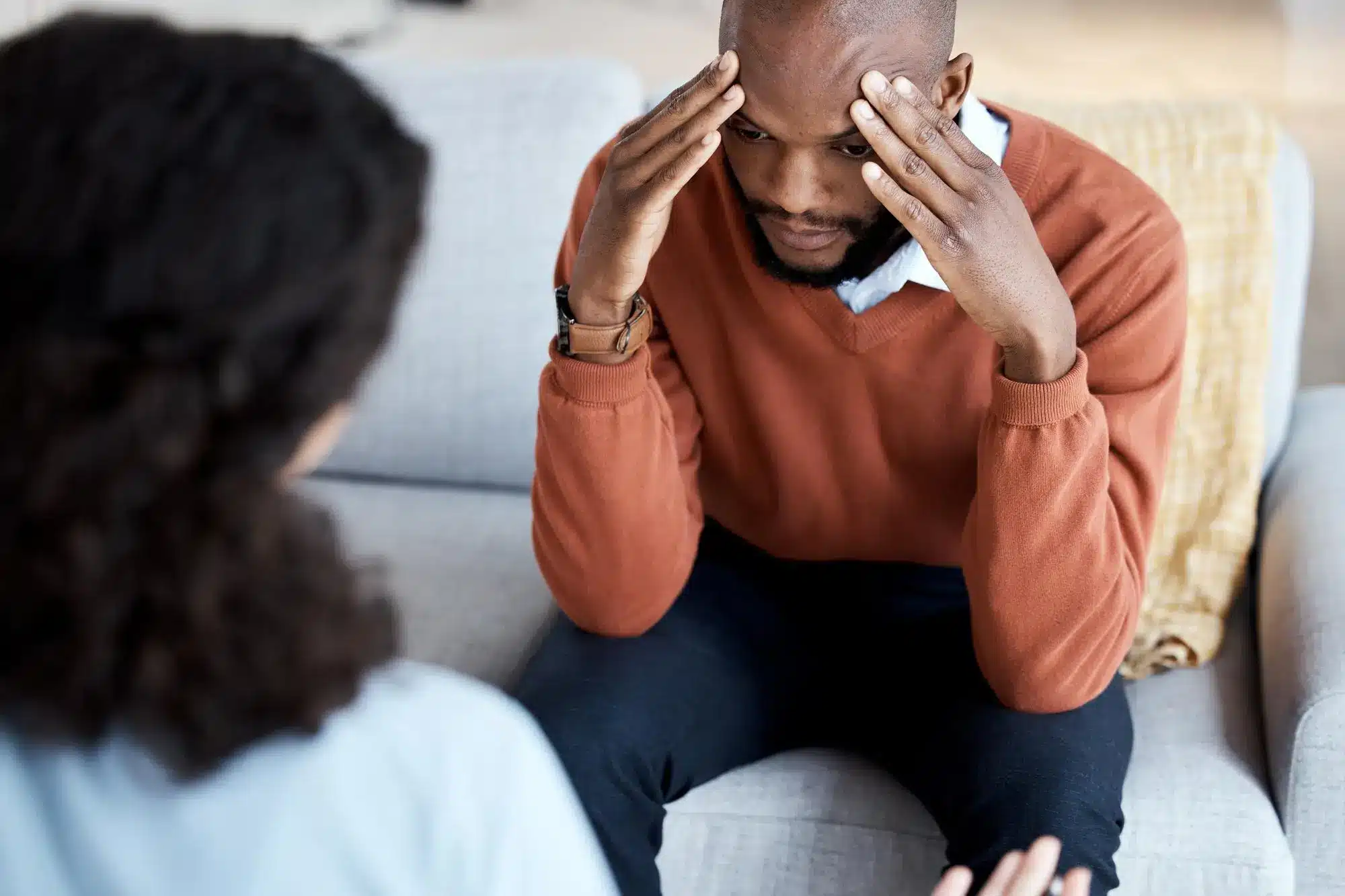 man talking to healthcare provider in a medical clinic